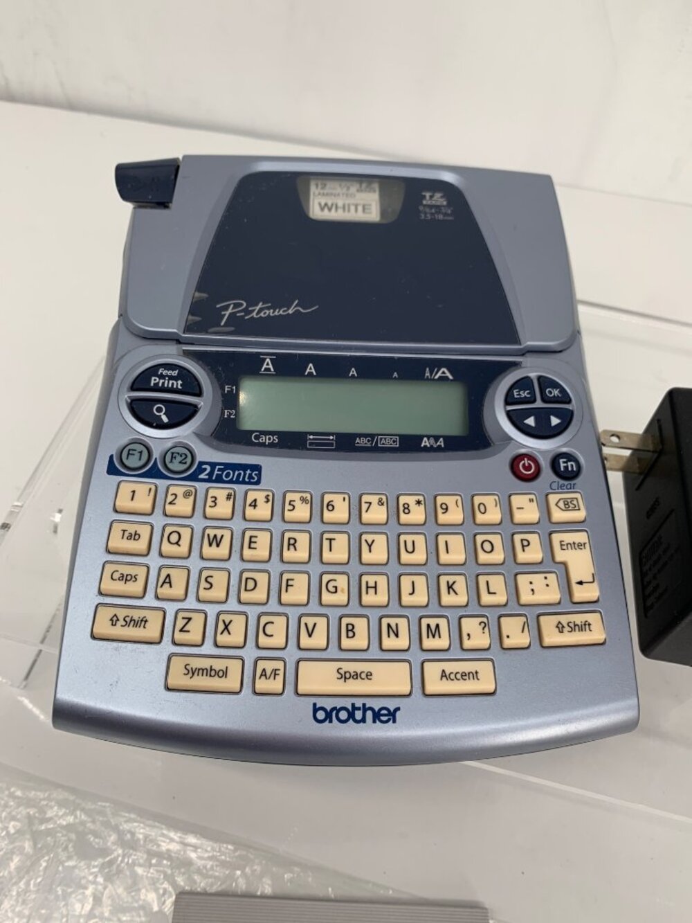 Brother P-Touch PT-1880 Label Maker With Laminated White Tape